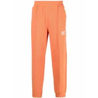 helmut lang pantalon de jogging fuselé à logo imprimé - orange
