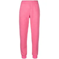 moschino pantalon de jogging à logo imprimé - rose