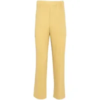 homme plissé issey miyake pantalon de costume à design plissé - jaune
