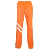 god's masterful children pantalon de jogging à empiècements géométriques - orange