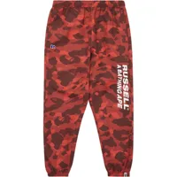 a bathing ape® x russell pantalon de jogging à rayures latérales - rouge