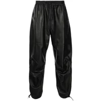alexander wang pantalon de jogging ample en cuir artificiel - noir