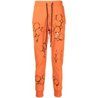 mauna kea pantalon de jogging à logo imprimé - orange