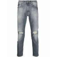 versace jeans couture jean slim à finitions effilochées - bleu