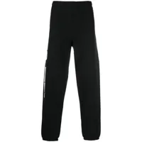 heron preston pantalon de jogging à logo imprimé - noir