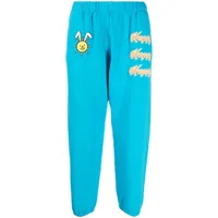 natasha zinko pantalon de jogging à imprimé happy - bleu