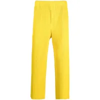 homme plissé issey miyake pantalon fuselé à design plissé - jaune