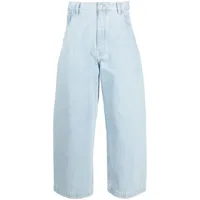 studio nicholson jean ample à coupe courte - bleu