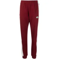 sporty & rich x lacoste pantalon de jogging en piqué - rouge